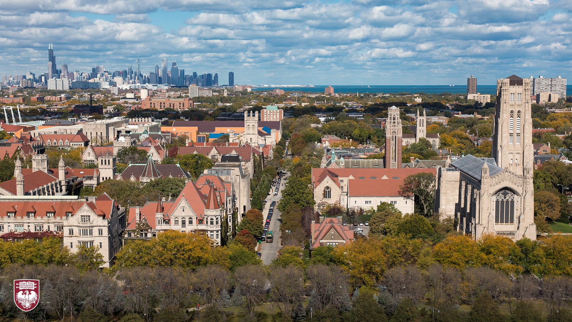 Aerial view of Hyde Park campus mid day with Chicago skyline in the background